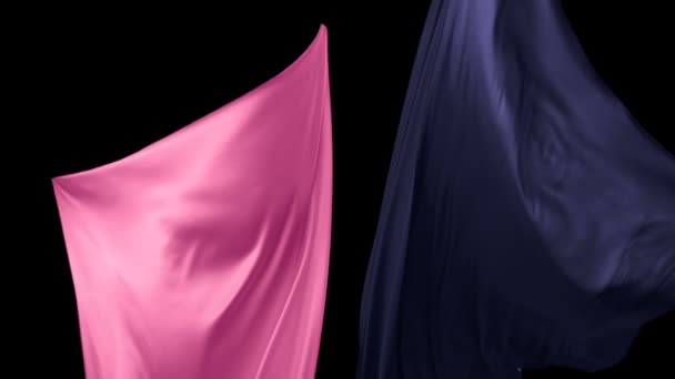 Blue and pink fabric flowing in the air — Stock Video