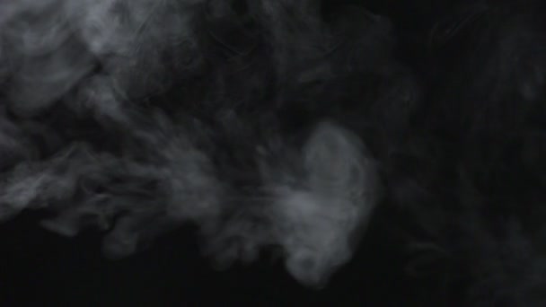 Smoke coming out on black background — Stock Video