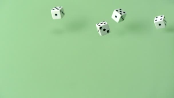 Dices rolling on green background — Stock Video