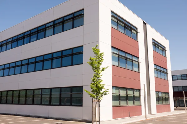 Small suburban office building, the exterior under blue sky