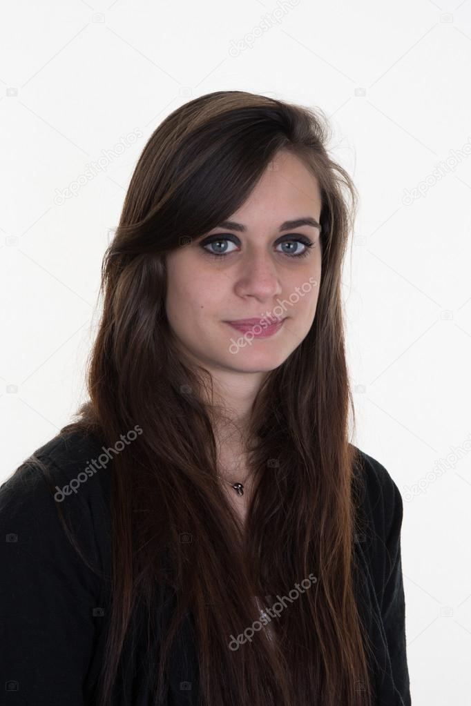 Serious young woman without makeup on a white background
