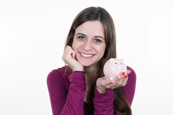 Jonge vrouw met spaarvarken geïsoleerd op witte achtergrond — Stockfoto