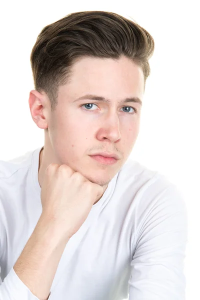 Young man holding his hand on chin and thinking — Stock Photo, Image
