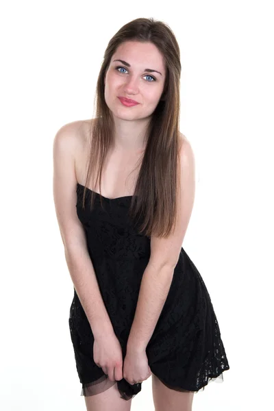 Fröhliche junge Brünette mit blauen Augen und schwarzem Kleid — Stockfoto