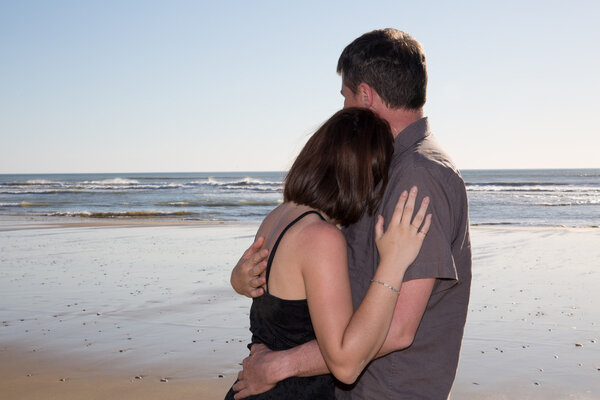 Loving couple cuddling at the beach love affair