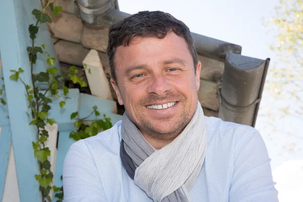 Closeup of handsome guy wearing blue shirt and scarf — Stock Photo, Image