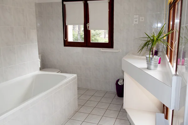 Bright space - a silver tap in a white bathroom — Stock Photo, Image