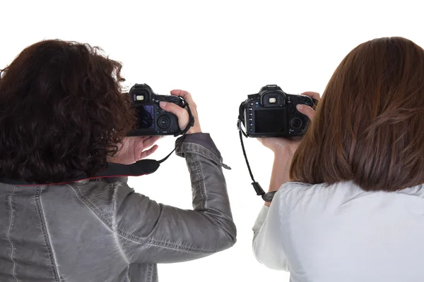 Professional female photographer from back taking picture