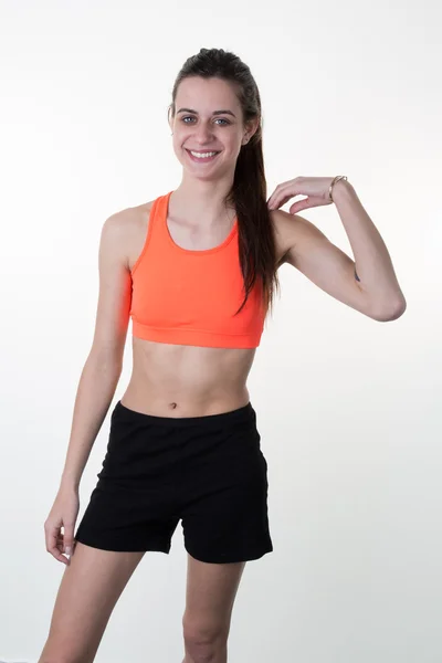 A very skinny woman wearing sport wear with long hair — Stock Photo, Image