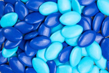 Turquoise and blue coated chocolate or almonds clipart