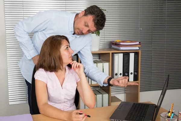Manager and his secretary working together in the office — Stock Photo, Image