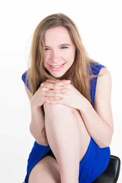 Teenager model posing in studio with a blue dress — Stock Photo, Image