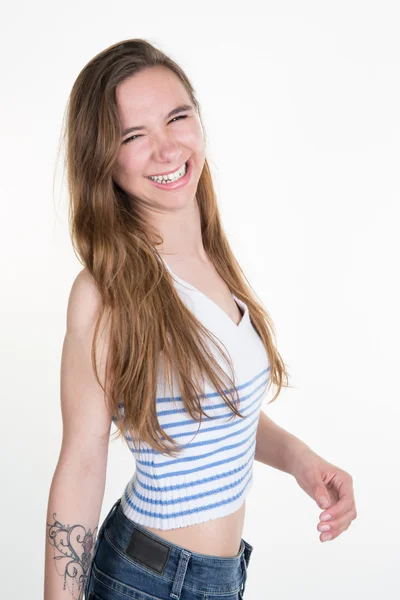 Beautiful blonde teenager in comfortable jeans isolated — Stock Photo, Image