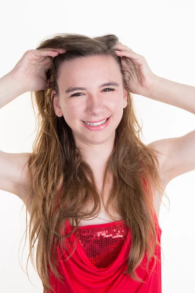 Ragazza adolescente in abito rosso isolato su sfondo bianco — Foto Stock