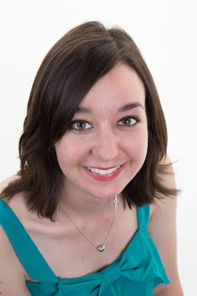 Picture of a smiling young brunette with a green top Stock Photo