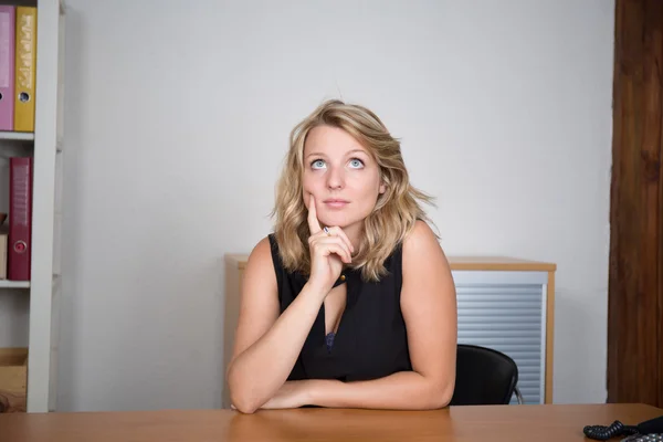 Thoughtful woman touching her lips on white — Stock Photo, Image