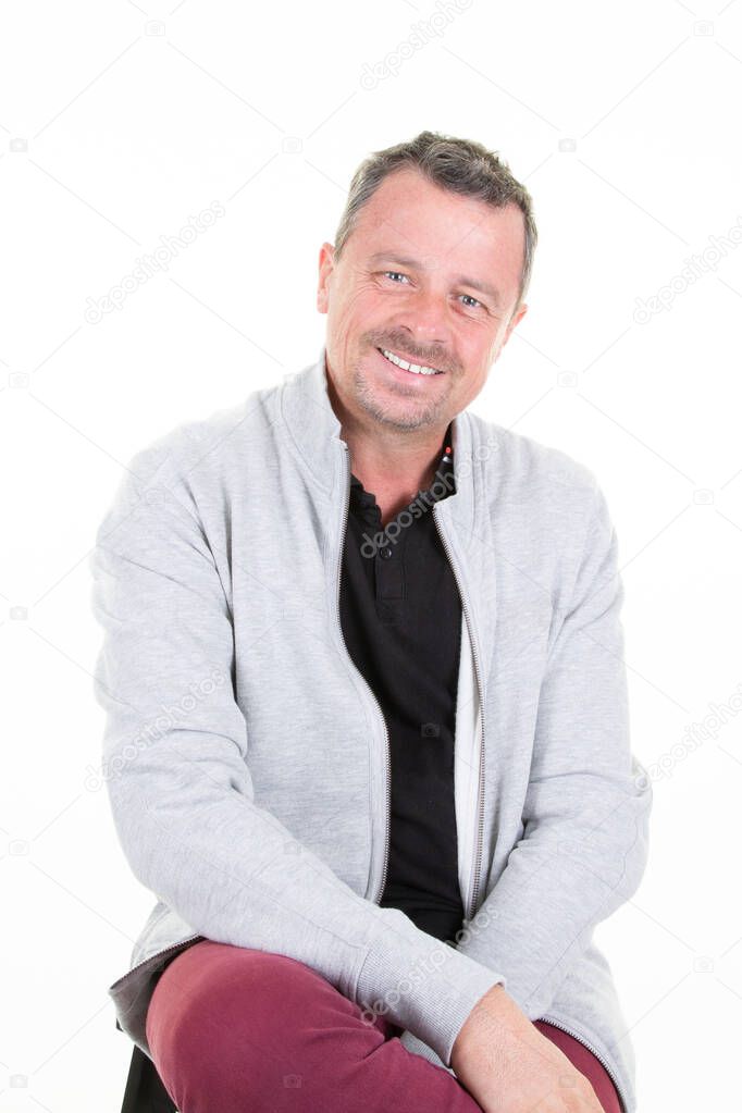 positive feeling portrait of happy handsome middle aged man smiling