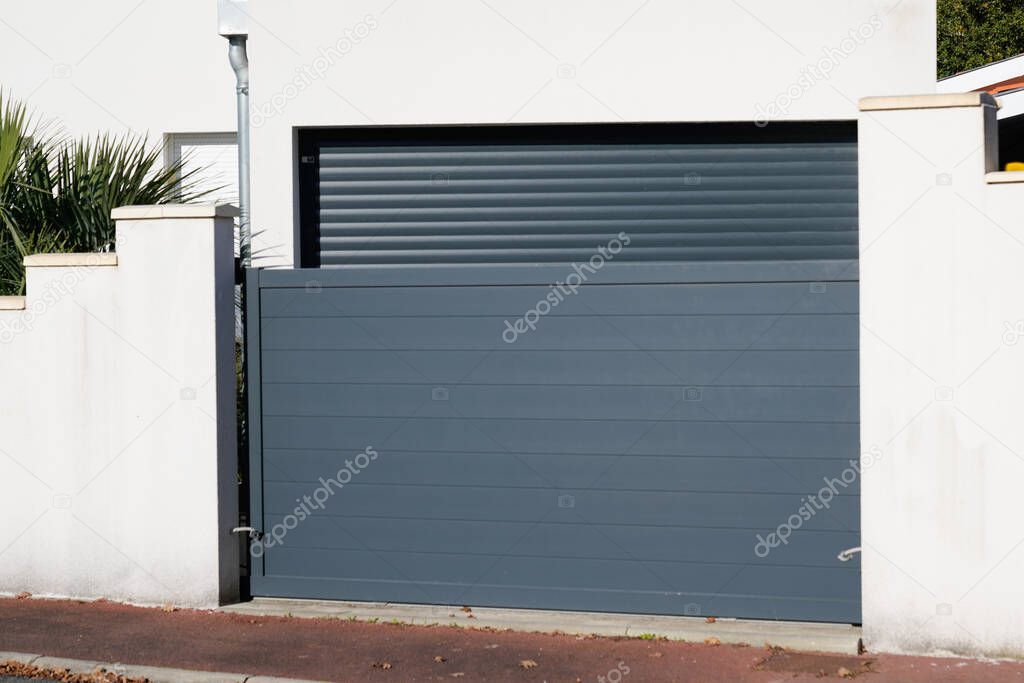 sliding portal large metal gate grey fence on suburb street house door