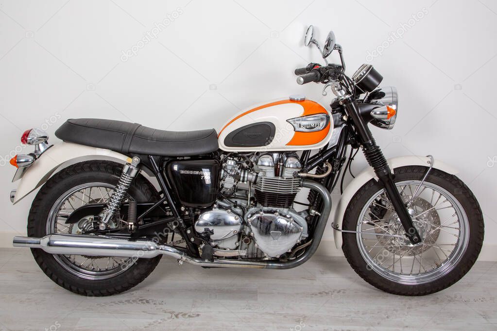 Bordeaux , Aquitaine  France - 12 15 2020 : triumph motorcycle side view with sign text and logo on fuel tank on motorbike vintage in studio shoot