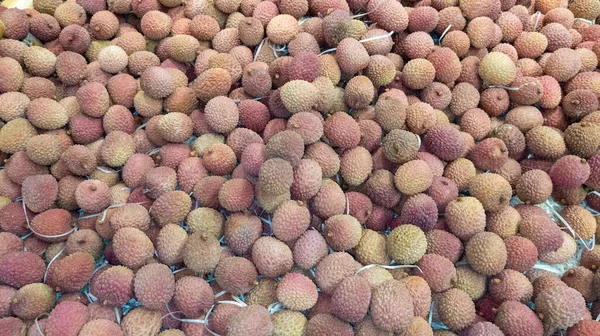 litchi fruit crate for sale on the market as background or wallpaper