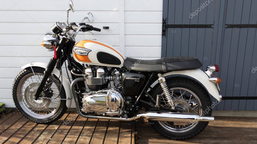 Bordeaux , Aquitaine  France - 12 28 2020 : Triumph bonneville t100 motorcycle in vintage style retro parked outdoors