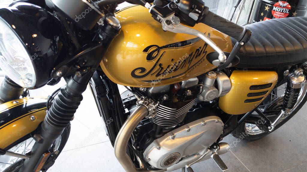 Bordeaux , Aquitaine  France - 12 28 2020 : triumph bonneville t120 motorcycle detail sign text and logo on golden fuel tank on motorbike vintage