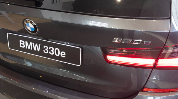 Bordeaux, Aquitaine France - 01 24 2021: BMW 3 series 330e rear of car with logo and sign brand german vehicle in dealership showroom