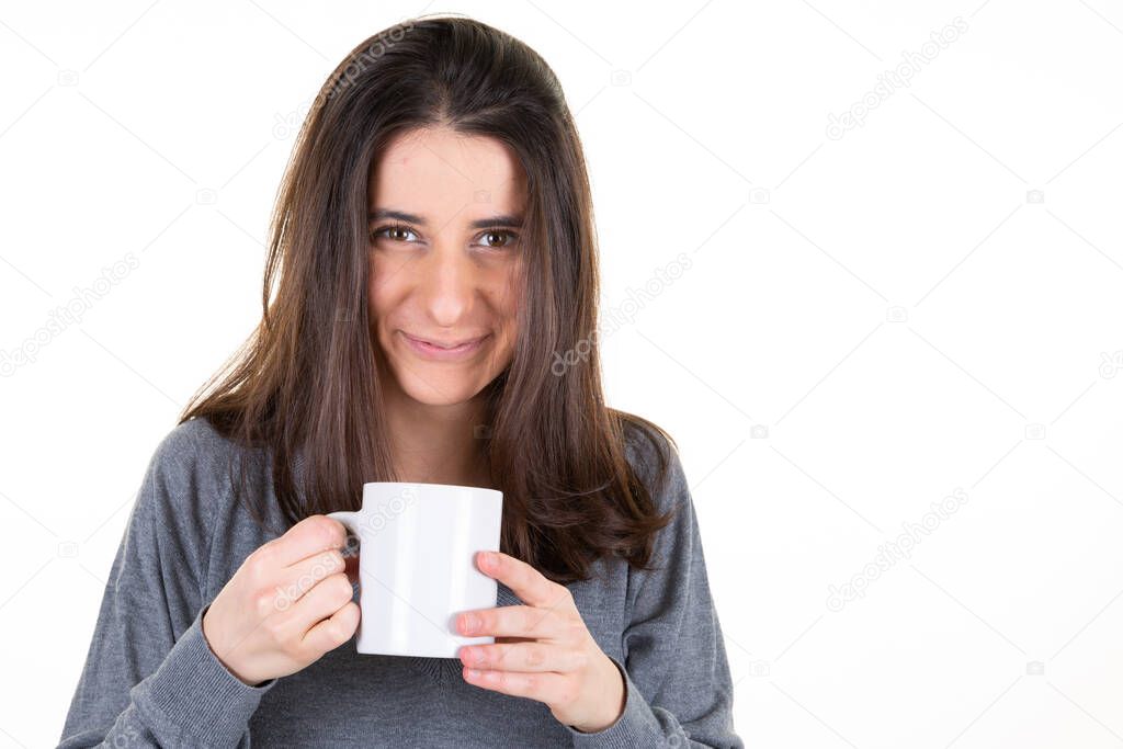 portrait of happy young woman with mug cup of tea coffee hotdrink