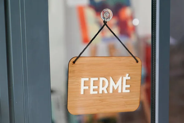 ferme means in french closed boutique on wooden sign board wood on windows shop restaurant cafe store signboard