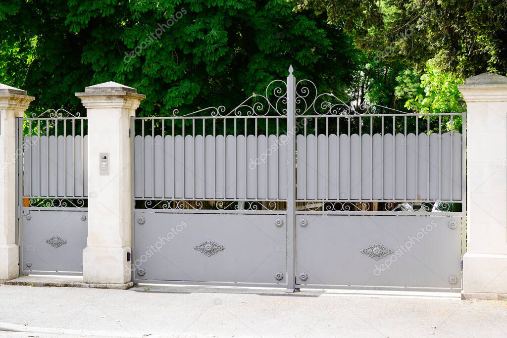 portal old grey classic metal home gate at entrance of classic old ancien house garden door in france europe