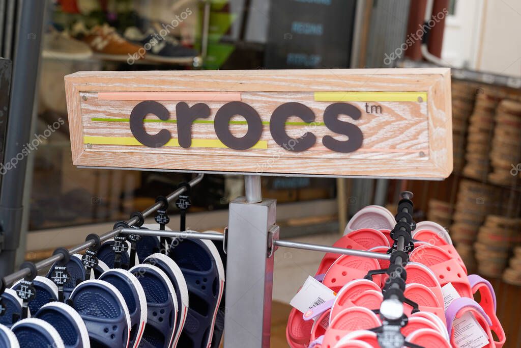 Montpellier , ocitanie France  - 06 30 2021 : crocs text sign and logo brand of American company store manufactured foam clog shoes shop footwear