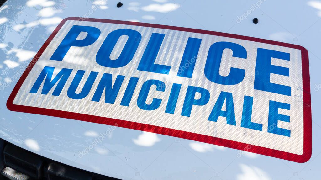 Police municipale car hood means in french Municipal police vehicle with sign logo text