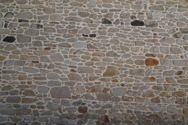 石の古い壁のヴィンテージテクスチャ背景高レンガのサイド異なるサイズの石 — ストック写真