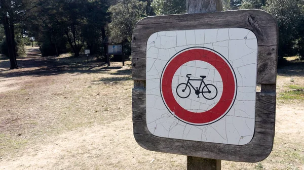 no bicycles sign panel in park pathway forbidden cycle prohibition bike