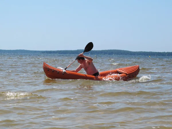 Man with paddle and kayak Royalty Free Stock Images