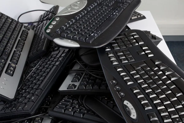 Computer keyboard on a pile — Stock Photo, Image
