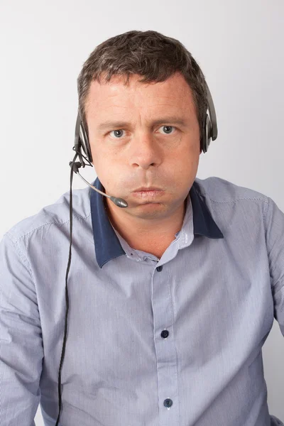 Muž s headsetem na rozrušení — Stock fotografie