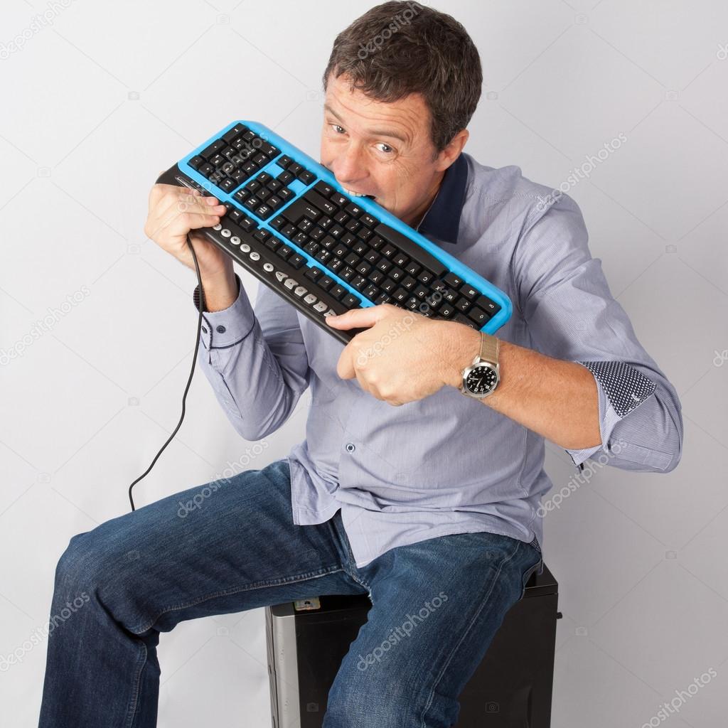 Man is playing with his keyboard computer