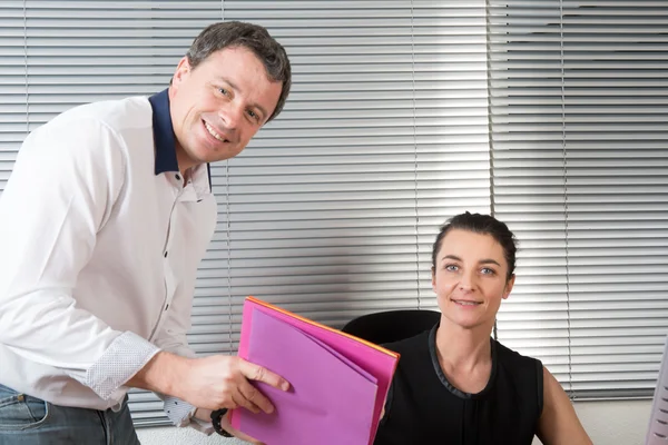 Portrait of a man and a woman at work — Stock Photo, Image