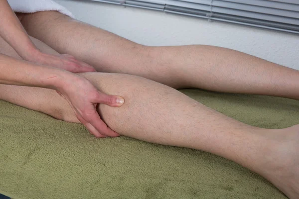 Man receiving massage relax treatment close-up from female hands — Zdjęcie stockowe