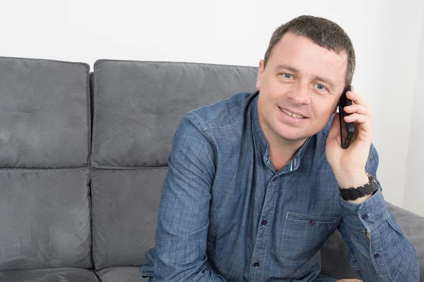 Portrait of nice man with his phone — Stock Photo, Image