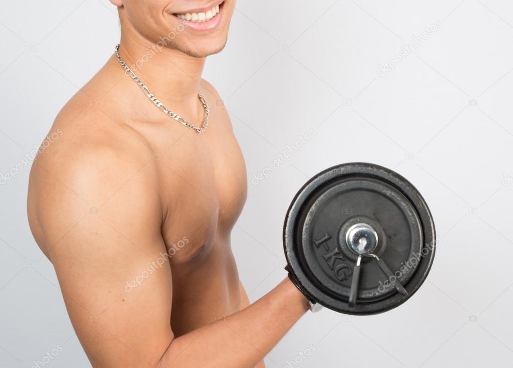 Young man with dumbells
