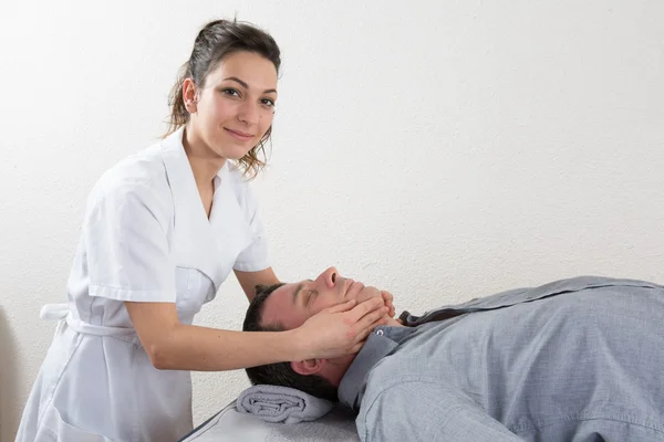 Handsome man having a face massage — Stock Photo, Image