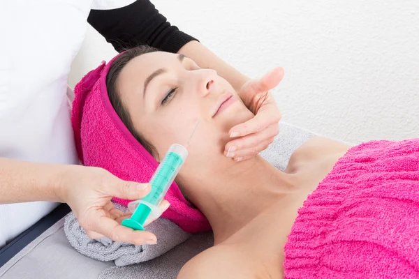 Woman is getting an injection — Stock Photo, Image