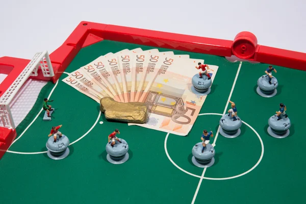 Figures of football player on euro banknotes — Stock Photo, Image