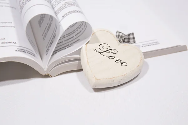 A Heart book  page and wood heart — Stock Photo, Image