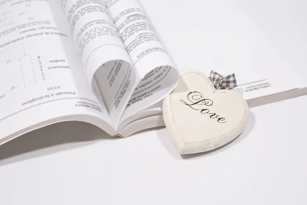 A Heart book page and wood heart — Stock Photo, Image