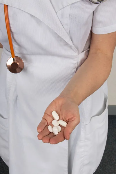 Several blister packs in nurse hands — Stock Photo, Image