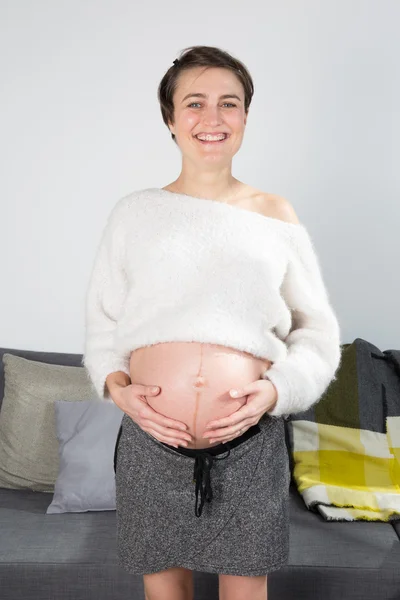 Nice and young woman pregnant — Stock Photo, Image