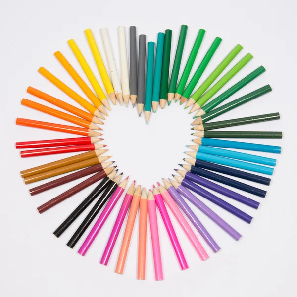 Colored pencils frame heart shaped — Stock Photo, Image